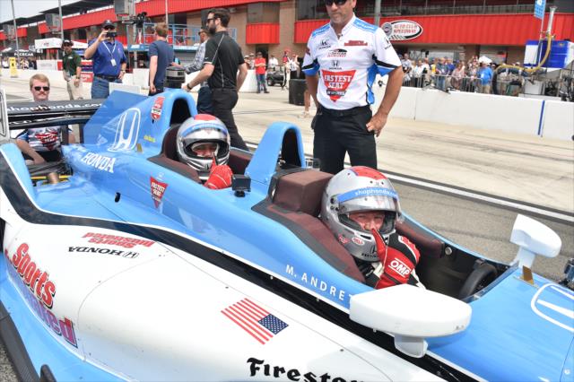 Jay Leno and Mario Andretti are strapped in and ready for their two-seater ride at Auto Club Speedway -- Photo by: Chris Owens