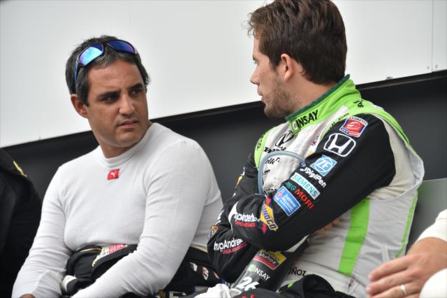 Colombian drivers Juan Pablo Montoya and Carlos Munoz chat backstage during pre-race festivities for the MAVTV 500 at Auto Club Speedway -- Photo by: Chris Owens