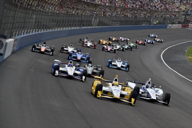 Simon Pagenaud leads the field into Turn 1 at the start of the MAVTV 500 at Auto Club Speedway -- Photo by: Chris Owens