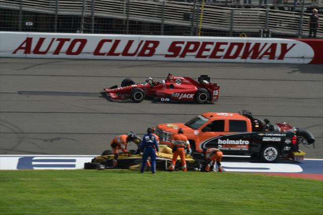 The Holmatro Safety Team assist with Ryan Briscoe as Graham Rahal takes the win in the MAVTV 500 at Auto Club Speedway -- Photo by: Chris Owens
