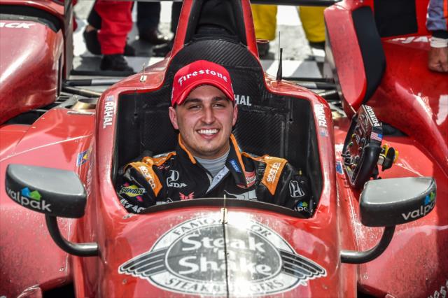 Graham Rahal sits in his Honda after pulling into Victory Lane following his win in the MAVTV 500 at Auto Club Speedway -- Photo by: Chris Owens