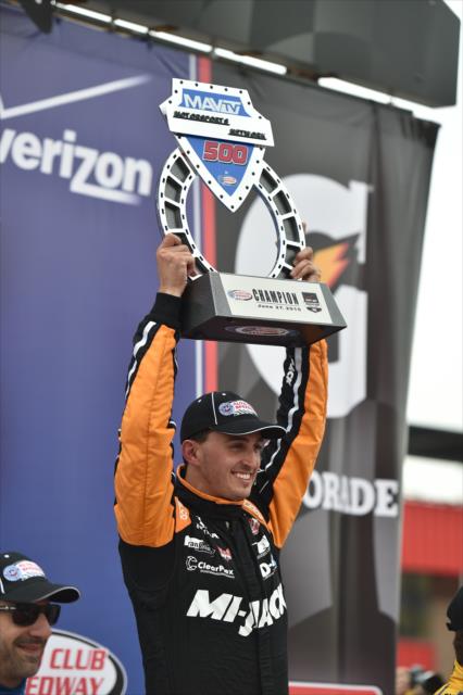 Graham Rahal hoists his winner's trophy after winning the MAVTV 500 at Auto Club Speedway -- Photo by: Chris Owens