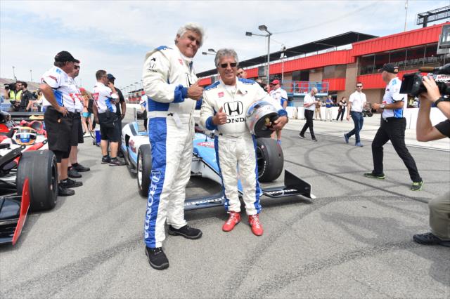 Jay Leno and Mario Andretti prepare to take a two-seater ride around Auto Club Speedway -- Photo by: Chris Owens