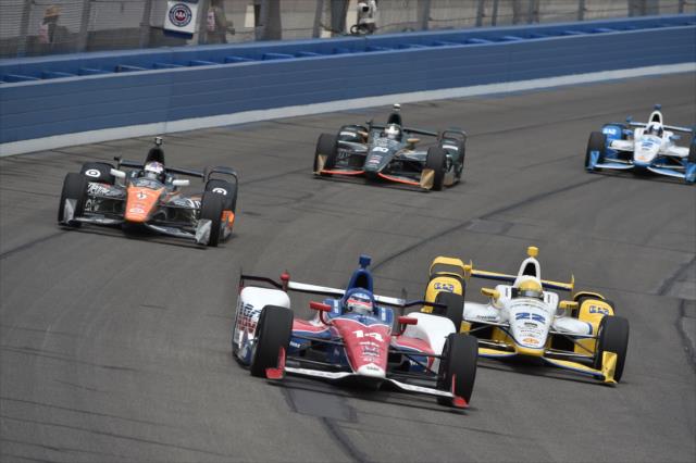 Takuma Sato leads Simon Pagenaud and the field into Turn 3 during the MAVTV 500 at Auto Club Speedway -- Photo by: Chris Owens