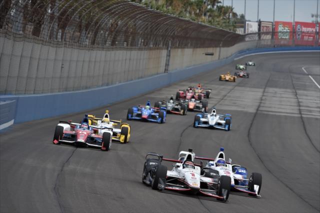 Will power leads the field into Turn 3 during the MAVTV 500 at Auto Club Speedway -- Photo by: Chris Owens