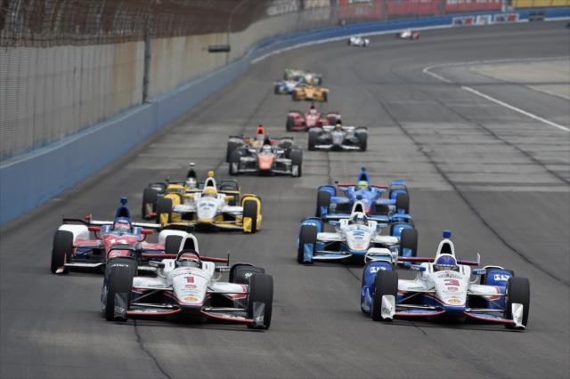 Will Power and Helio Castroneves lead the field into Turn 3 during the MAVTV 500 at Auto Club Speedway -- Photo by: Chris Owens