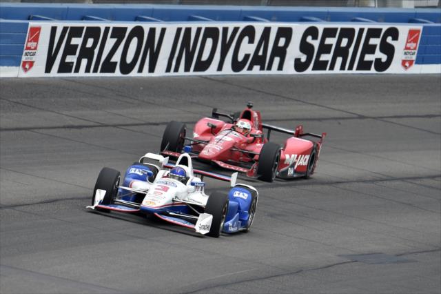 Helio Castroneves leads Graham Rahal into Turn 2 during the MAVTV 500 at Auto Club Speedway -- Photo by: Chris Owens