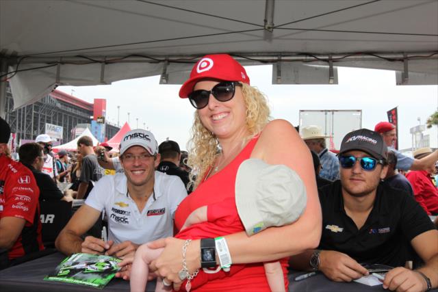 Sebastien Bourdais and Stefano Coletti pause for a photograph during the autograph session in the INDYCAR Fan Village at Auto Club Speedway -- Photo by: Richard Dowdy