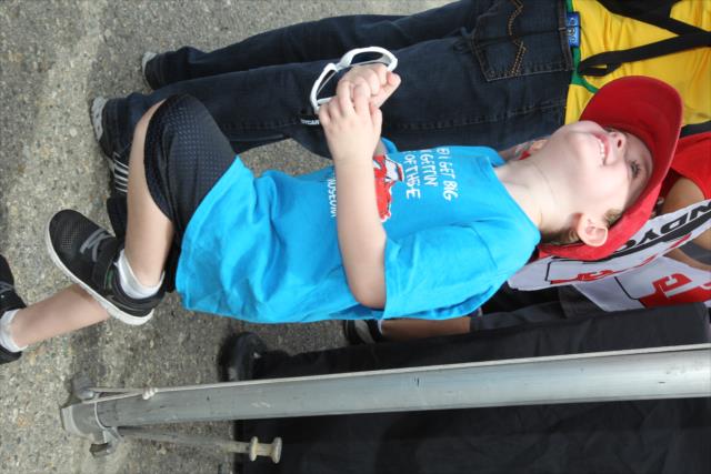 A young fan waits for an autograph during the autograph session in the INDYCAR Fan Village at Auto Club Speedway -- Photo by: Richard Dowdy