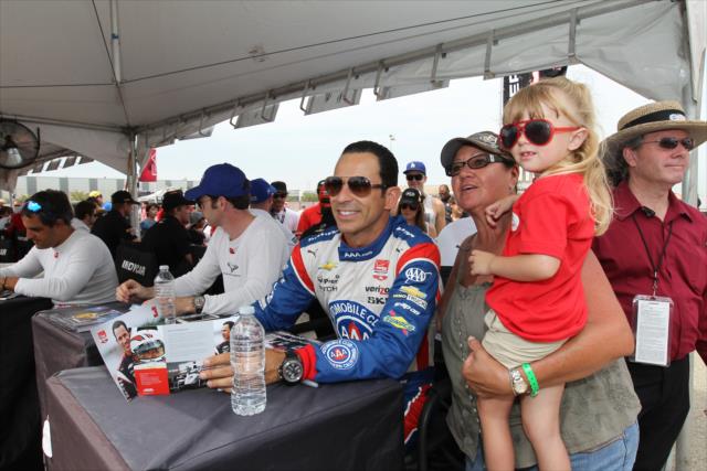Helio Castroneves poses for a photograph during the autograph session in the INDYCAR Fan Village at Auto Club Speedway -- Photo by: Richard Dowdy