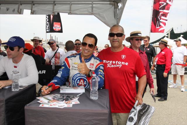 Helio Castroneves poses for a photograph during the autograph session in the INDYCAR Fan Village at Auto Club Speedway -- Photo by: Richard Dowdy