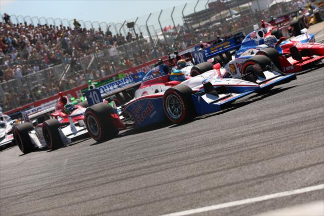 Sebastien Bourdais pushes around the outside of Graham Rahal -- Photo by: Shawn Gritzmacher