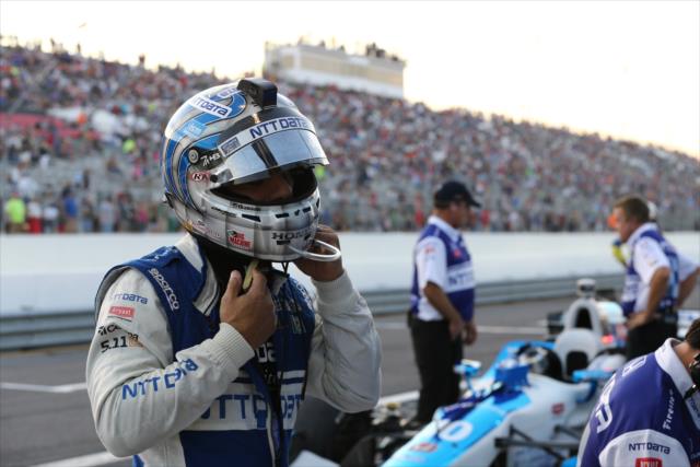 Tony Kanaan tightens his helmet prior to the pit stop competition before the start of the Bommarito Automotive Group 500 at Gateway Motorsports Park -- Photo by: Chris Jones