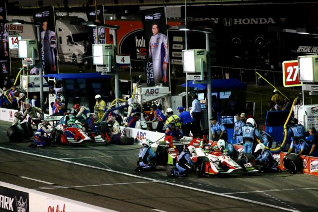 Marco Andretti and Conor Daly come in for tires and fuel on pit lane during the Bommarito Automotive Group 500 at Gateway Motorsports Park -- Photo by: Bret Kelley