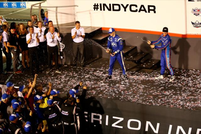 Josef Newgarden and Scott Dixon spray the champagne in Victory Circle following the Bommarito Automotive Group 500 at Gateway Motorsports Park -- Photo by: Bret Kelley