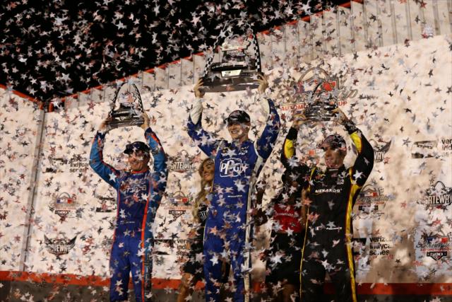 The confetti flies over Josef Newgarden, Scott Dixon, and Simon Pagenaud on Victory Stage following the Bommarito Automotive Group 500 at Gateway Motorsports Park -- Photo by: Chris Jones
