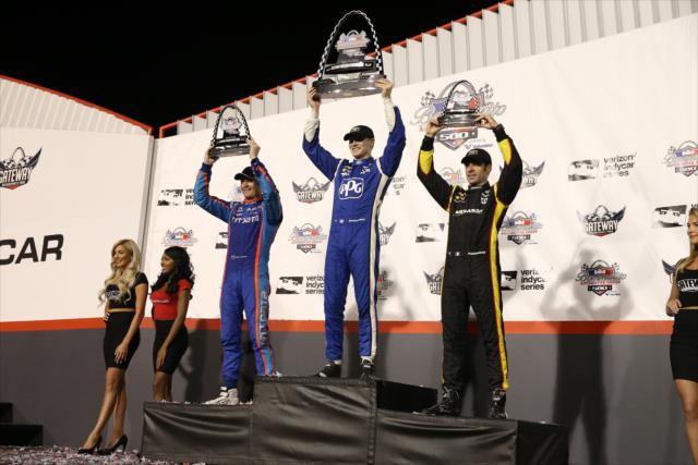 The podium of Josef Newgarden, Scott Dixon, and Simon Pagenaud hoist their trophies on Victory Stage following the Bommarito Automotive Group 500 at Gateway Motorsports Park -- Photo by: Chris Jones
