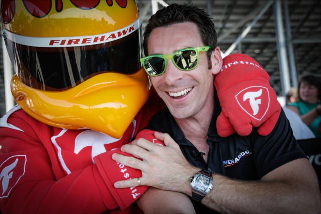 The Firestone Firehawk gives some love to Simon Pagenaud during the autograph session in the INDYCAR Fan Village at Gateway Motorsports Park -- Photo by: Shawn Gritzmacher