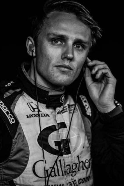 Max Chilton sets his earpieces along pit lane prior to the Bommarito Automotive Group 500 at Gateway Motorsports Park -- Photo by: Shawn Gritzmacher