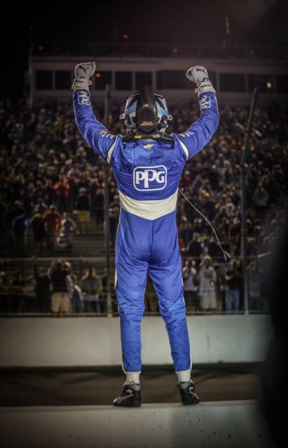 Josef Newgarden celebrates on the pit lane wall after winning the Bommarito Automotive Group 500 at Gateway Motorsports Park -- Photo by: Shawn Gritzmacher
