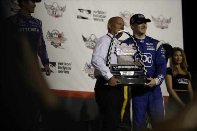 Josef Newgarden is presented his 1st Place trophy on Victory Stage after winning the Bommarito Automotive Group 500 at Gateway Motorsports Park -- Photo by: Shawn Gritzmacher