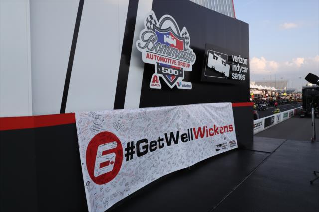 The signed #GetWellWickens banner on stage during pre-race festivities for the Bommarito Automotive Group 500 at Gateway Motorsports Park -- Photo by: Chris Jones