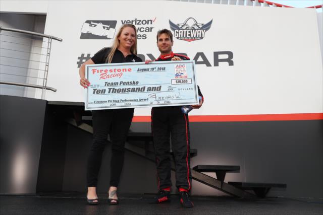 Will Power accepts the Firestone Pit Stop Performance Award on behalf of Team Penske for their performance at Pocono -- Photo by: Chris Jones