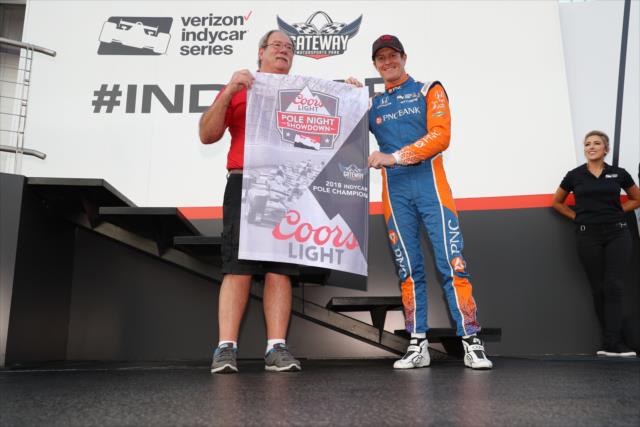 Scott Dixon accepts the Coors Light Pole Night Shootout Flag for starting on the pole position for the Bommarito Automotive Group 500 at Gateway Motorsports Park -- Photo by: Chris Jones