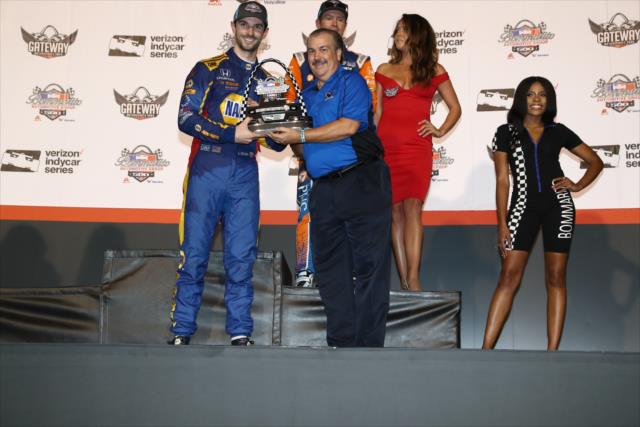 Alexander Rossi accepts his 2nd Place trophy on Victory Stage following the Bommarito Automotive Group 500 at Gateway Motorsports Park -- Photo by: Chris Jones