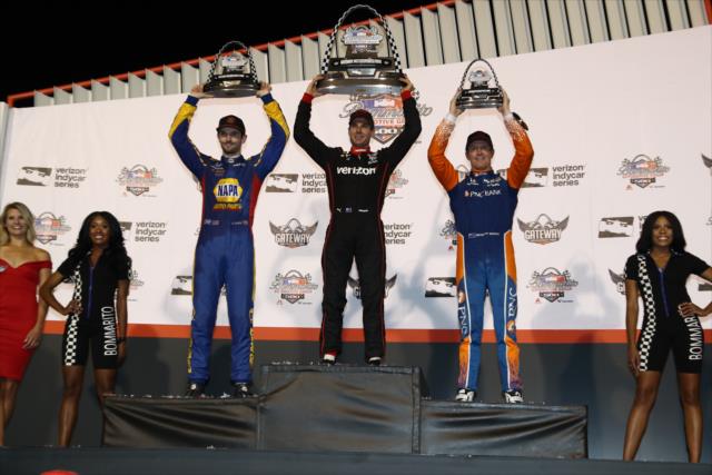 The podium of Will Power, Alexander Rossi, and Scott Dixon hoist their trophies on stage following the Bommarito Automotive Group 500 at Gateway Motorsports Park -- Photo by: Chris Jones