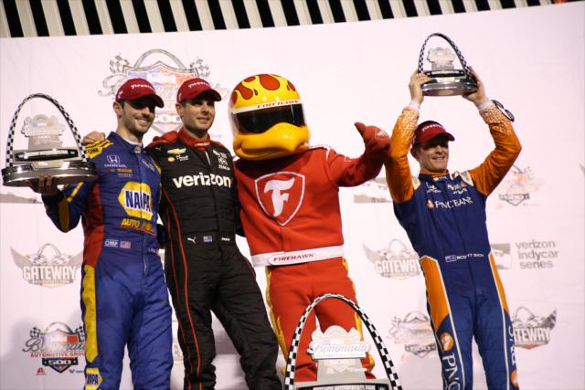 The podium of Will Power, Alexander Rossi, and Scott Dixon hoist their trophies with the Firestone Firehawk following the Bommarito Automotive Group 500 at Gateway Motorsports Park -- Photo by: Matt Fraver