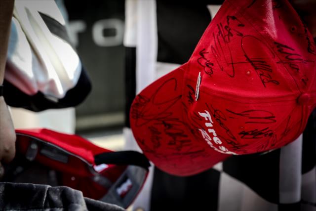 A fan gets his Firestone Racing hat autographed during the autograph session at Gateway Motorsports Park -- Photo by: Shawn Gritzmacher