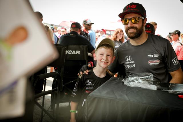 James Hinchcliffe poses for a photograph during the autograph session at Gateway Motorsports Park -- Photo by: Shawn Gritzmacher