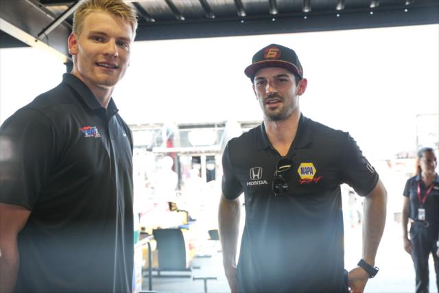 Alexander Rossi gives St. Louis Blues defenseman Colton Parayko a tour of the Andretti Autosrpot garages at Gateway Motorsports Park -- Photo by: Shawn Gritzmacher