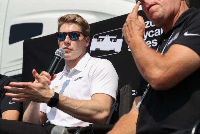 Josef Newgarden answers a question on stage during a Q&A Session in the INDYCAR Fan Village at Gateway Motorsports Park -- Photo by: Shawn Gritzmacher