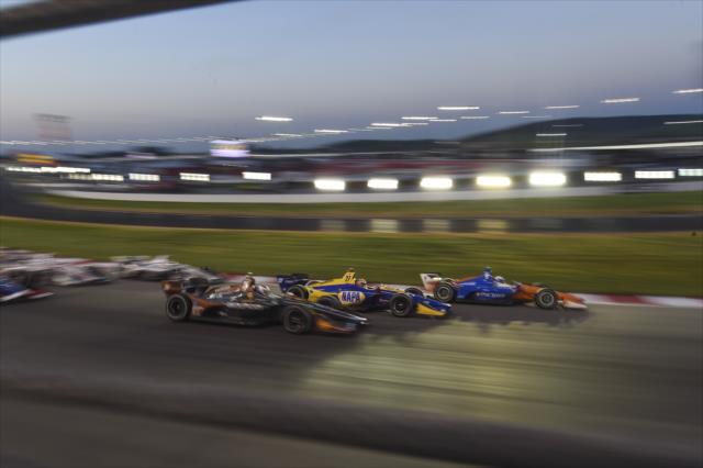 The field rolls through Turn 1 in rows of three to salute the fans during the parade laps prior to the start of the Bommarito Automotive Group 500 at Gateway Motorsports Park -- Photo by: Chris Owens