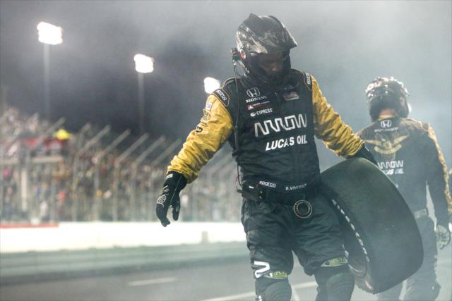 A Schmidt Peterson Motorsports crewman gathers a used tire on pit lane following a pit stop during the Bommarito Automotive Group 500 at Gateway Motorsports Park -- Photo by: Shawn Gritzmacher