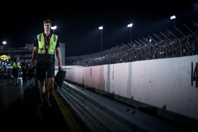A cameraman walks pit lane following the Bommarito Automotive Group 500 at Gateway Motorsports Park -- Photo by: Shawn Gritzmacher