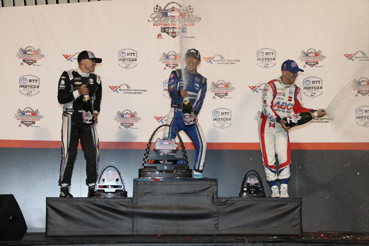 Ed Carpenter, Takuma Sato and Tony Kanaan on the Bommarito Automotive Group 500 podium -- Photo by: Chris Jones