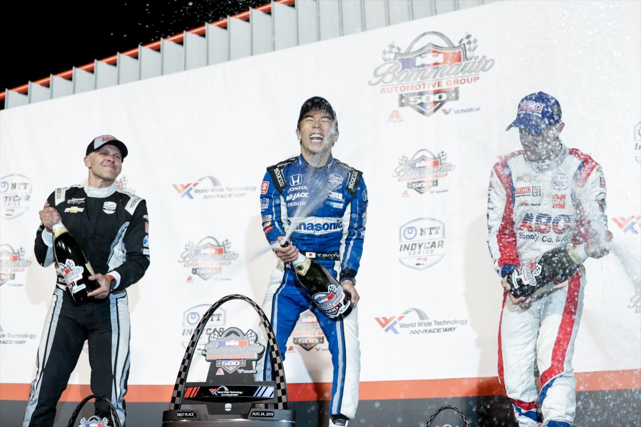 Ed Carpenter, Takuma Sato and Tony Kanaan celebrate on the Bommarito Automotive Group 500 podium -- Photo by: Joe Skibinski