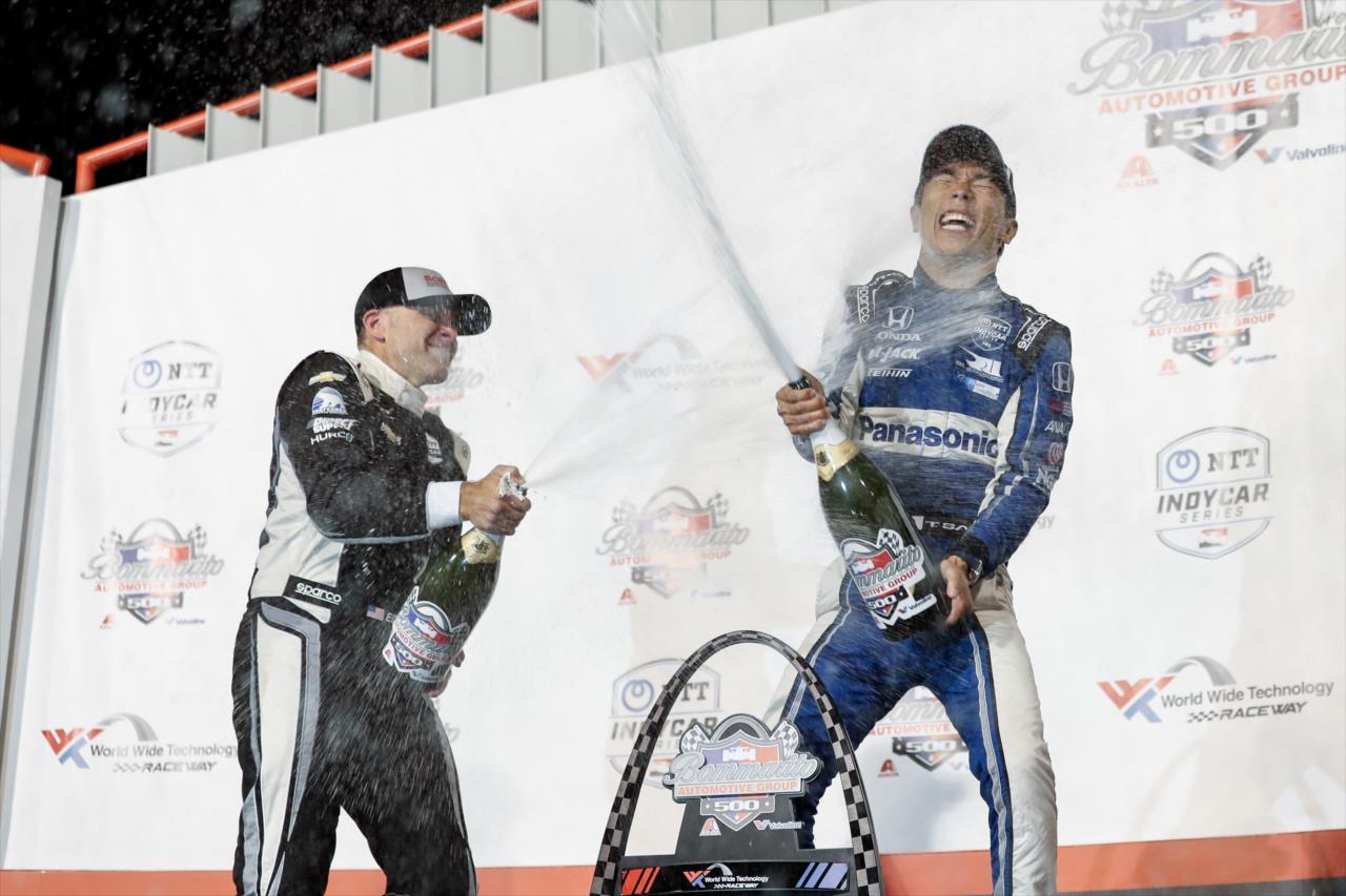 Ed Carpenter and Takuma Sato celebrate on the Bommarito Automotive Group 500 podium -- Photo by: Joe Skibinski