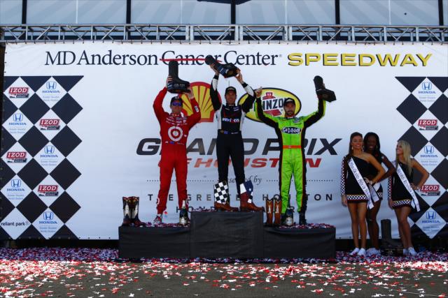 The podium of Will Power, Scott Dixon, and James Hinchcliffe raise their trophies in Houston -- Photo by: Bret Kelley