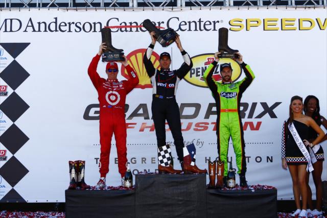 Will Power, Scott Dixon, and James Hinchcliffe raise their custom trophies after Race 2 of the Shell and Pennzoil Grand Prix of Houston -- Photo by: Bret Kelley