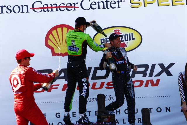 James Hinchcliffe and Scott Dixon give winner Will Power a champagne bath after Race 2 of the Shell and Pennzoil Grand Prix of Houston -- Photo by: Bret Kelley