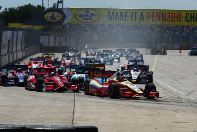 Helio Castroneves and Scott Dixon lead the field into Turn 2 at the start of Race 2 of the Shell and Pennzoil Grand Prix of Houston -- Photo by: Bret Kelley