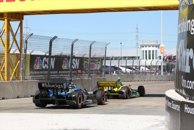 Tristan Vautier and Graham Rahal roll under the Pennzoil Bridge in Turn 1 during Race 2 of the Shell and Pennzoil Grand Prix of Houston -- Photo by: Chris Jones
