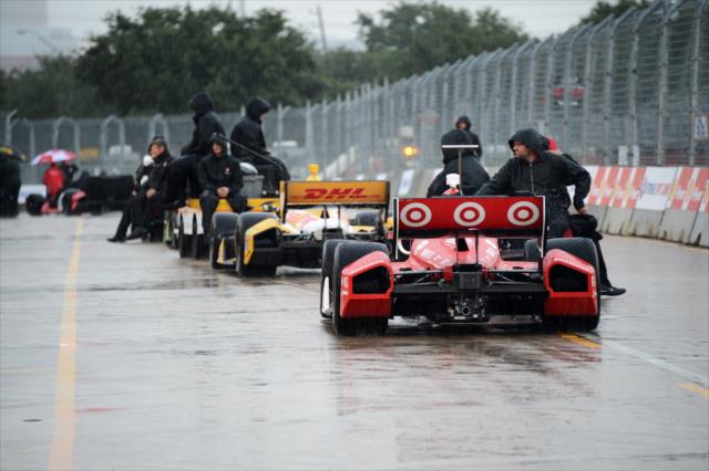 Cars roll back to the paddock -- Photo by: Chris Owens