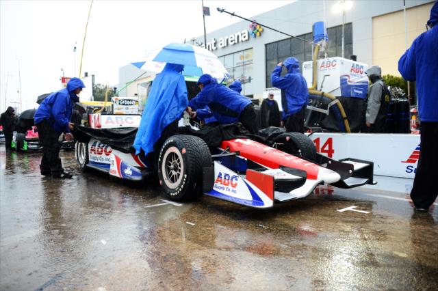 The A.J. Foyt Enterprises team cover up Takuma Sato's car before the qualification session -- Photo by: Chris Owens