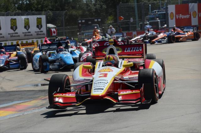 Helio Castroneves leads the field through the Turn 2 chicane during the start of Race 2 of the Shell and Pennzoil Grand Prix of Houston -- Photo by: Chris Owens