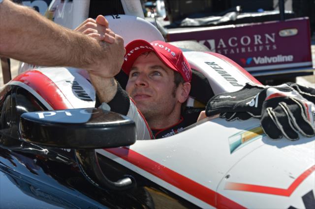 Will Power gets a congratulatory hand shake from a crew member after rolling into Victory Circle -- Photo by: John Cote